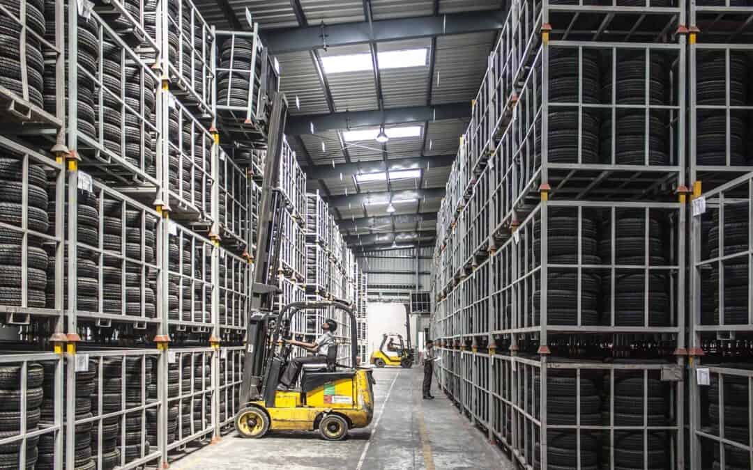 Forklift offloading in well lit warehouse