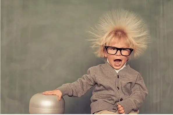 Child touching Static Machine and hair on end